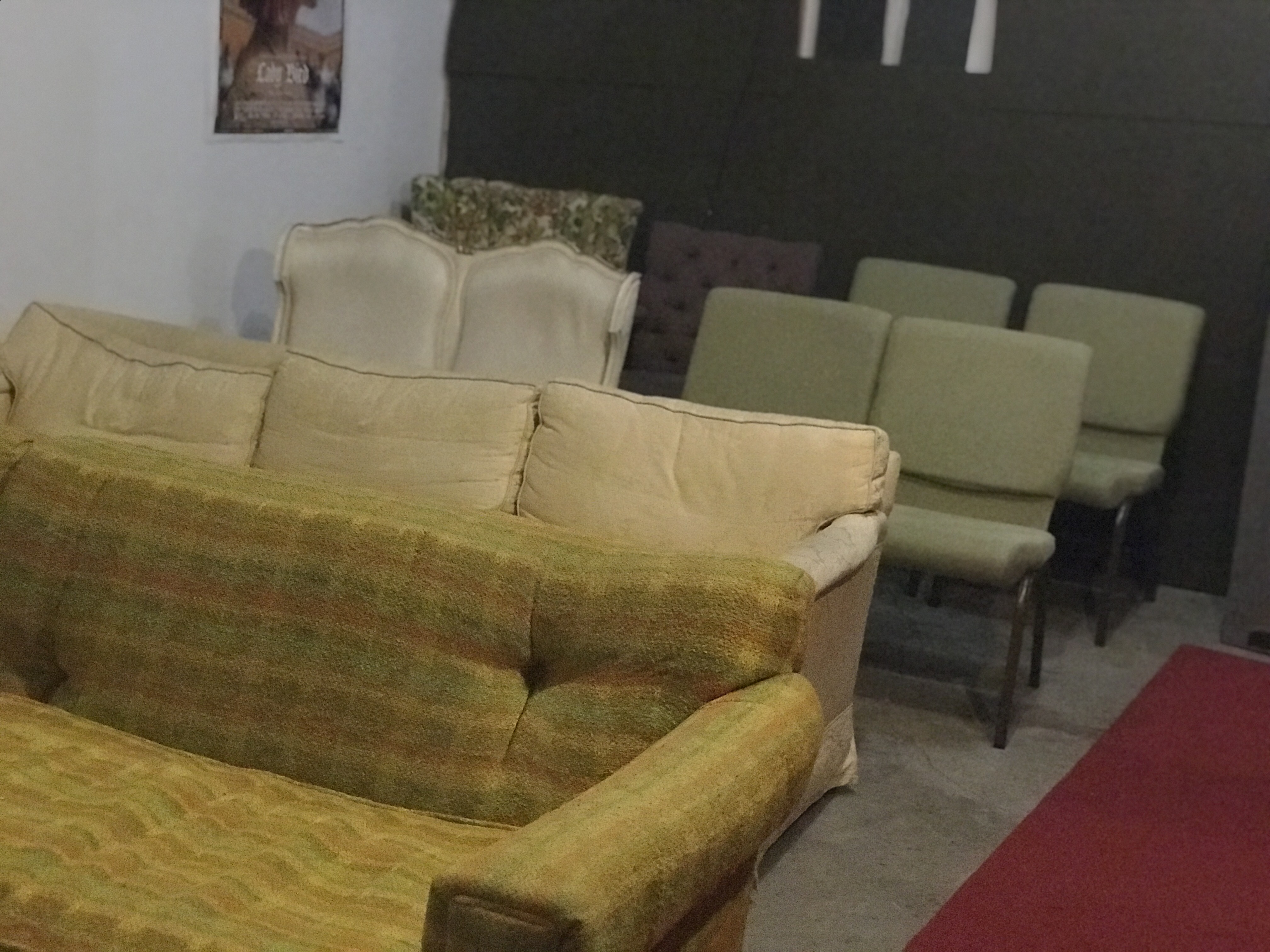 4 rows of seating with two couches, a loveseat, 4 armless chairs, and two armchairs